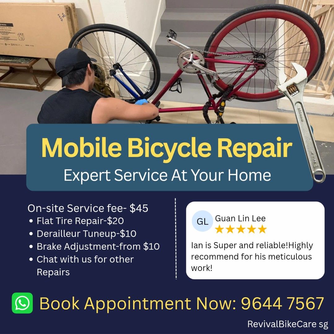 A mechanic working on an upturned red bicycle, from Revival Bikecare's service listing